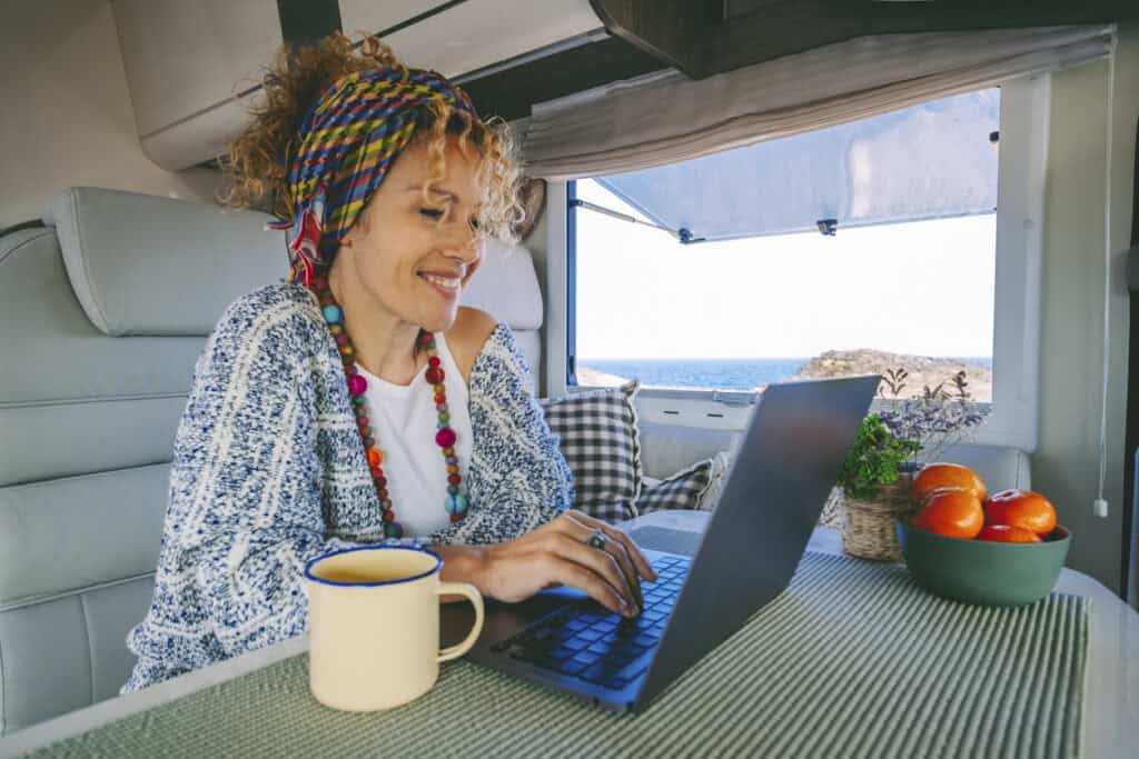 Woman working at her RV office in the living room