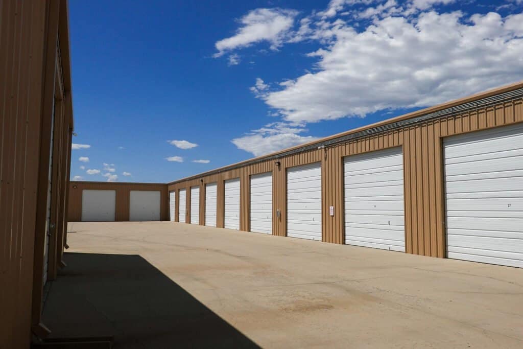 Mead_Garages_ClosedGarages-FromGround Outrig's Mead Garages Enclosed Storage with garage doors closed showing an entire row of units