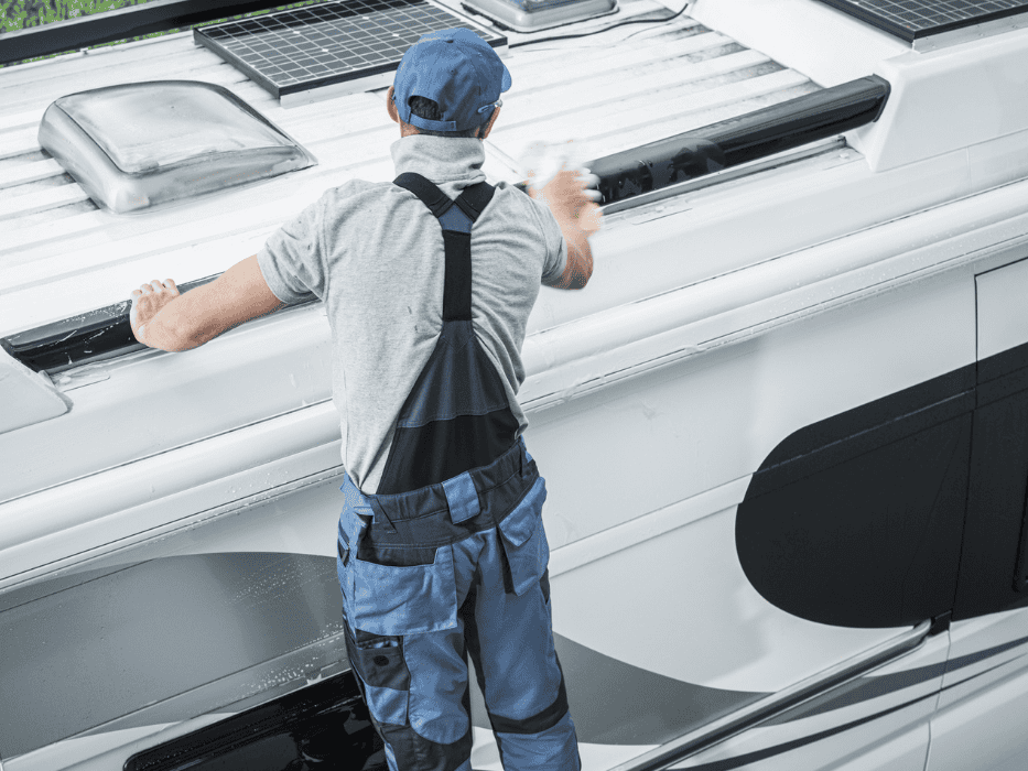 RV technician working on an RV awning