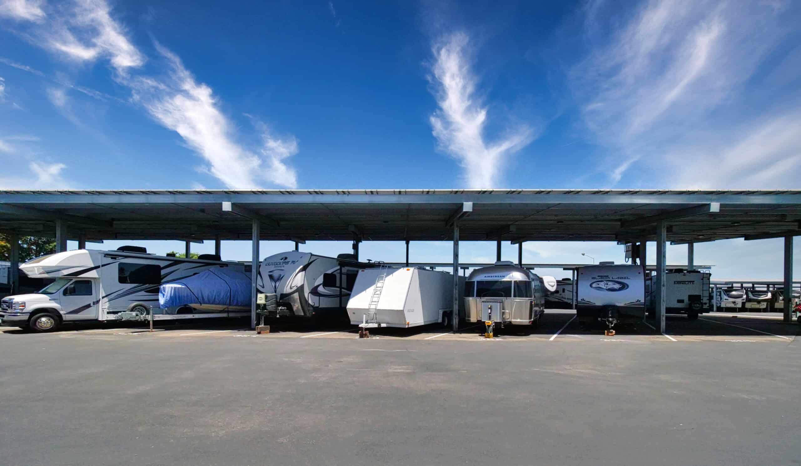 Outrig's Oakey Location Covered Parking with 6 boats and RVs parked underneath on a sunny day
