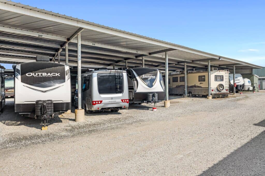 Outrig West 08252025-1-min Parking lot for recreational vehicles and travel trailers under a metal canopy at Outrig.