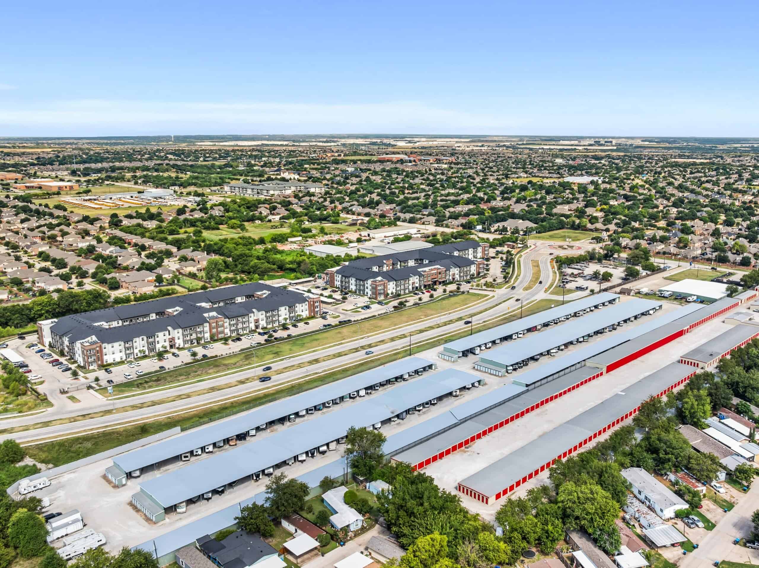 Outrig West 08252025-32-min Bright aerial view of Outrig logistics warehouse with loading docks and surrounding residential area.