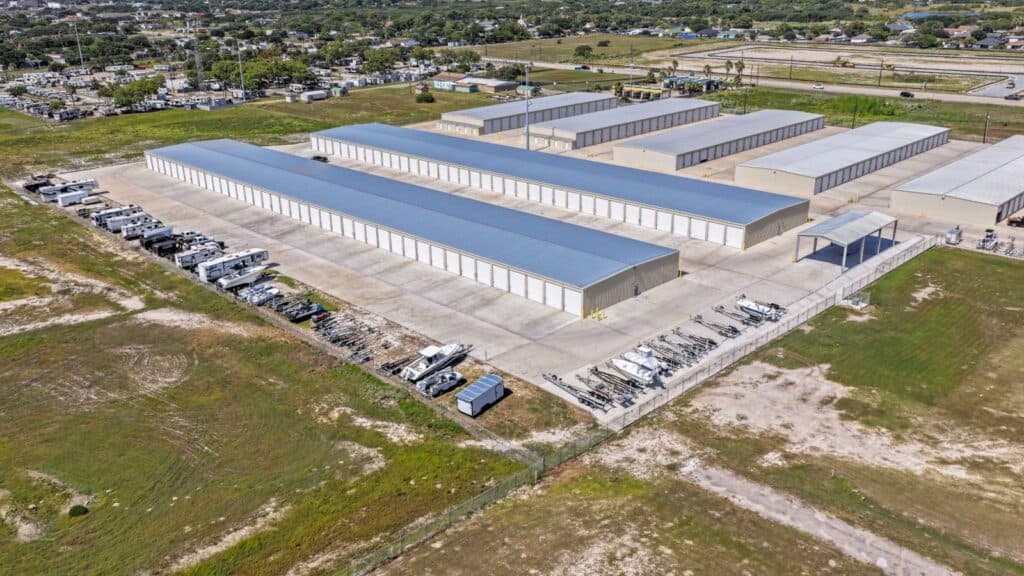 Large boat storage facility with multiple boat and RV storage units in an industrial area.