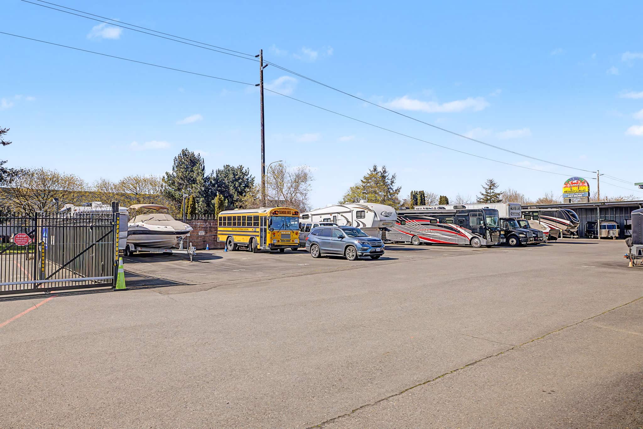 Outrig RV Boat Storage East Valley Featuring outdoor parking by gate