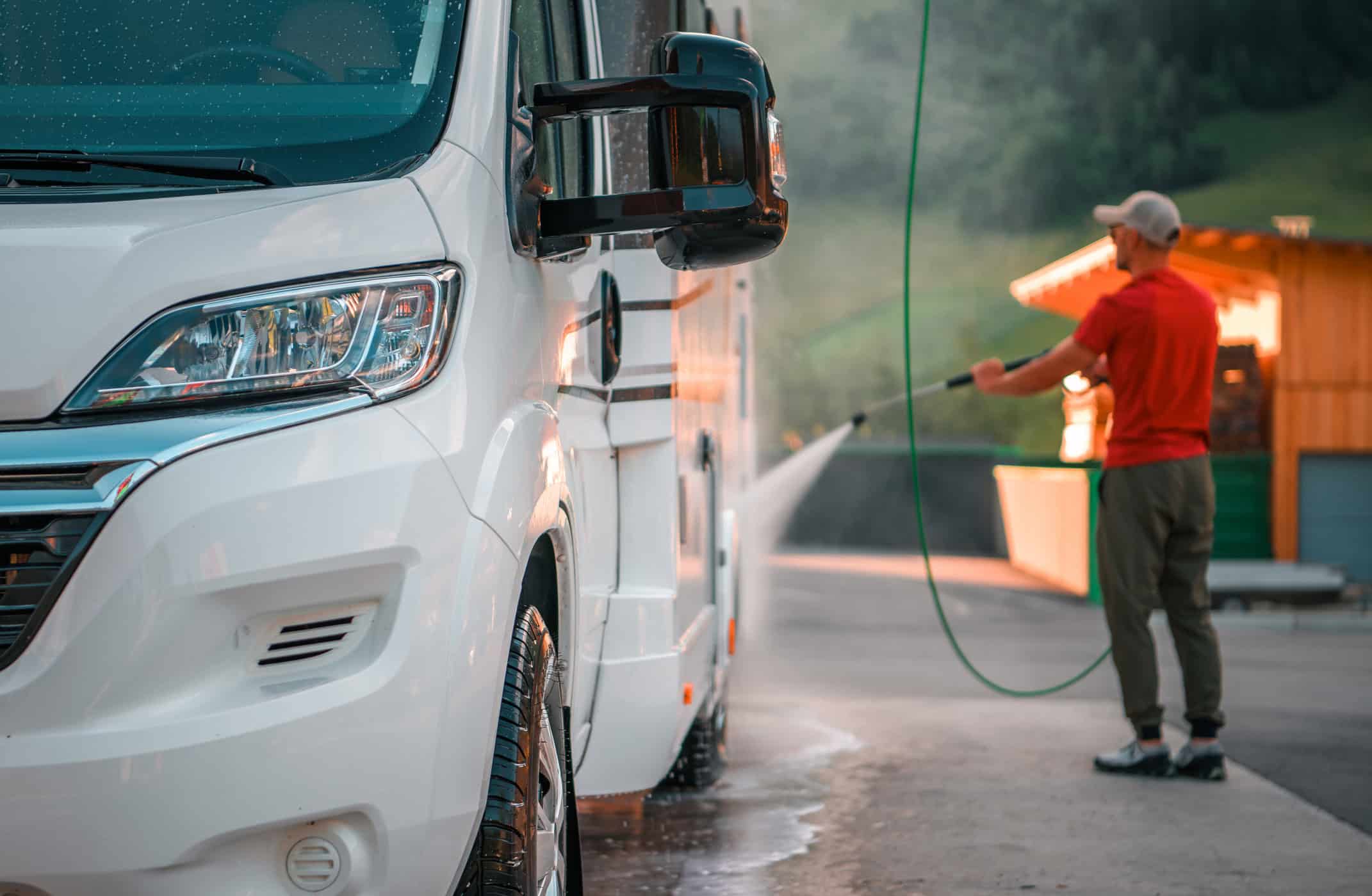 Man Washing an RV getting it ready for storage